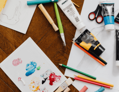 Paint and art class equipment on a table