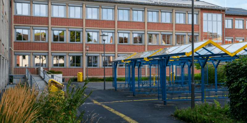 Outside of a school with bike racks