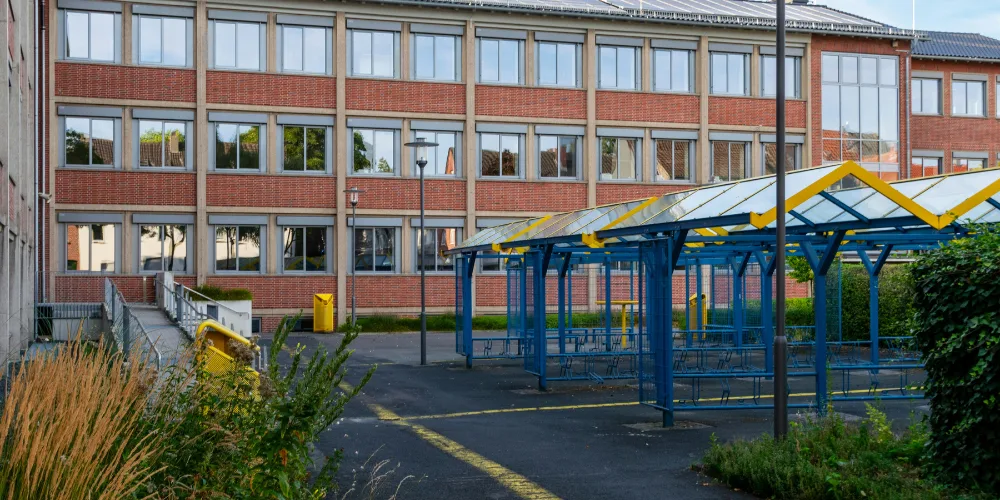 Outside of a school, with bike racks