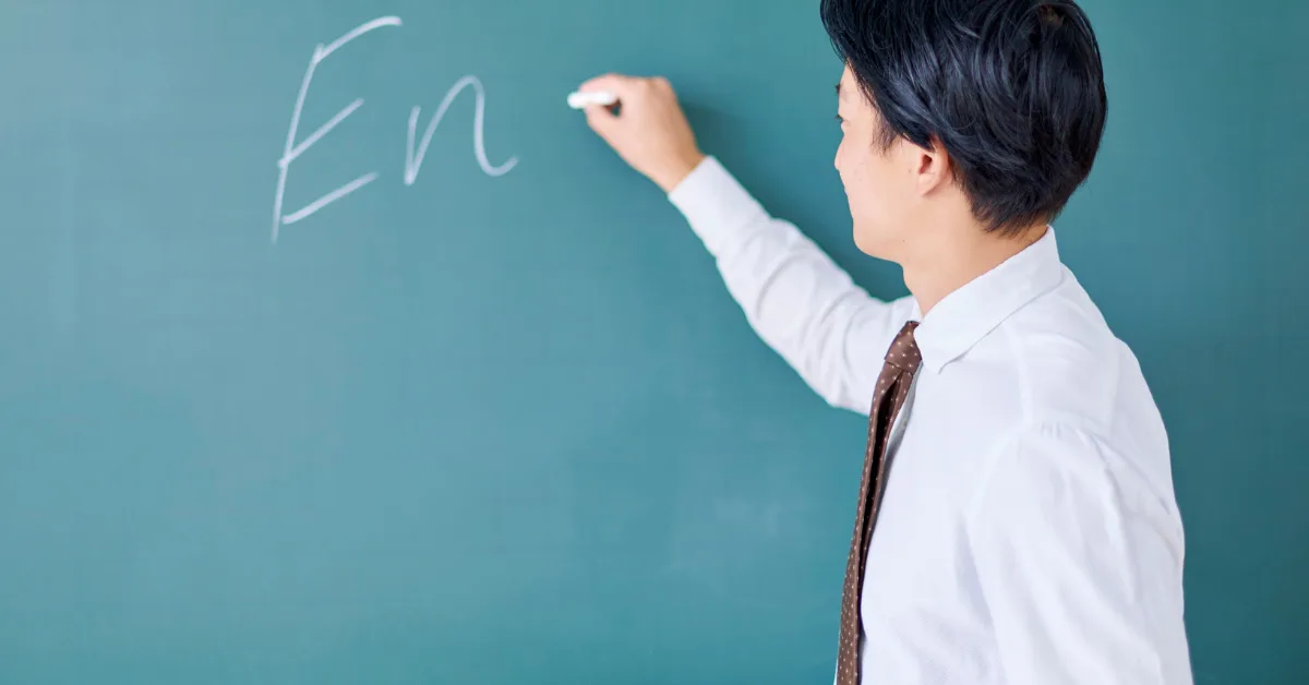 Teacher writing on the board