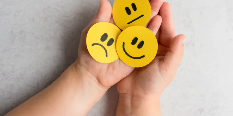 Paper rounds of different emotion faces